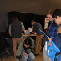 k-12 students looking at a senior project